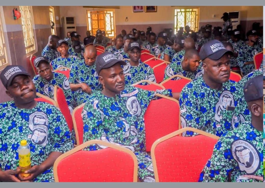 Union members wearing matching attire seated in rows