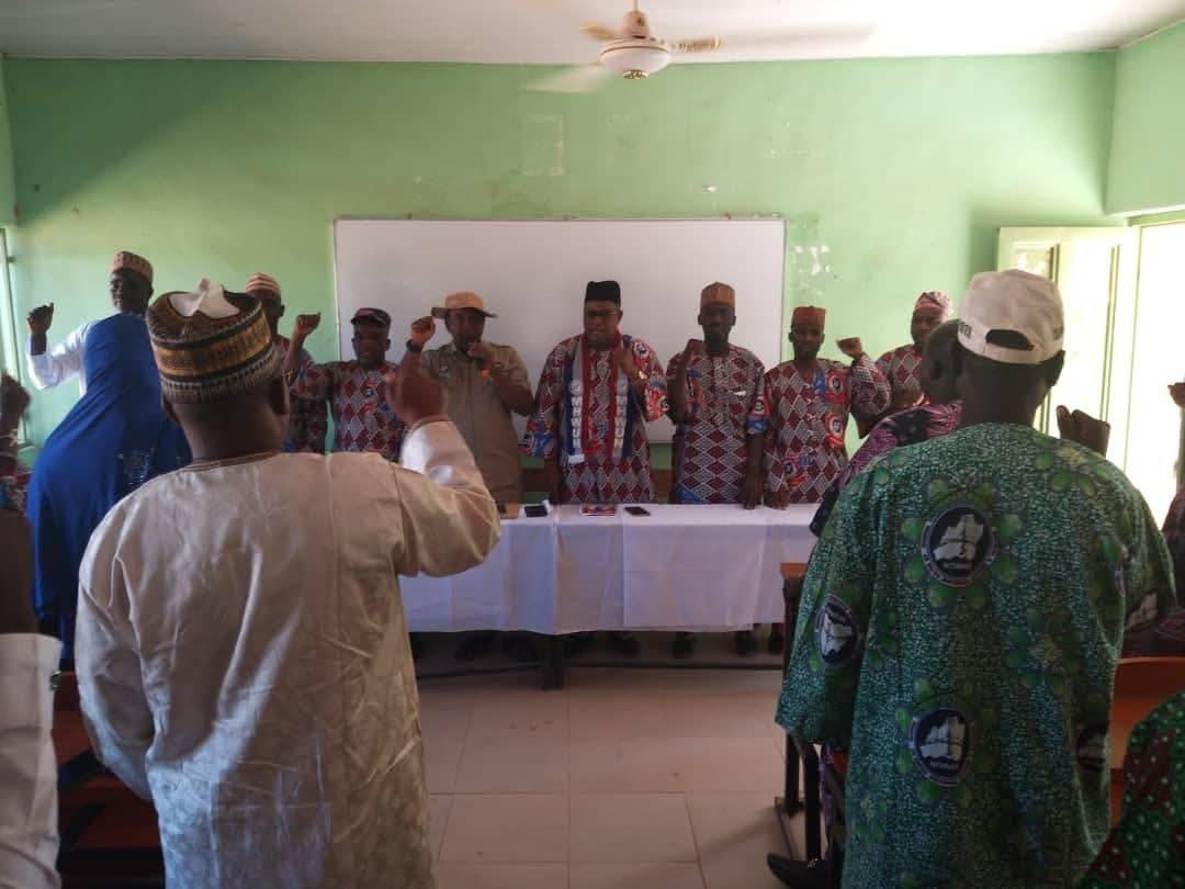 MHWUN family members seated at a long table