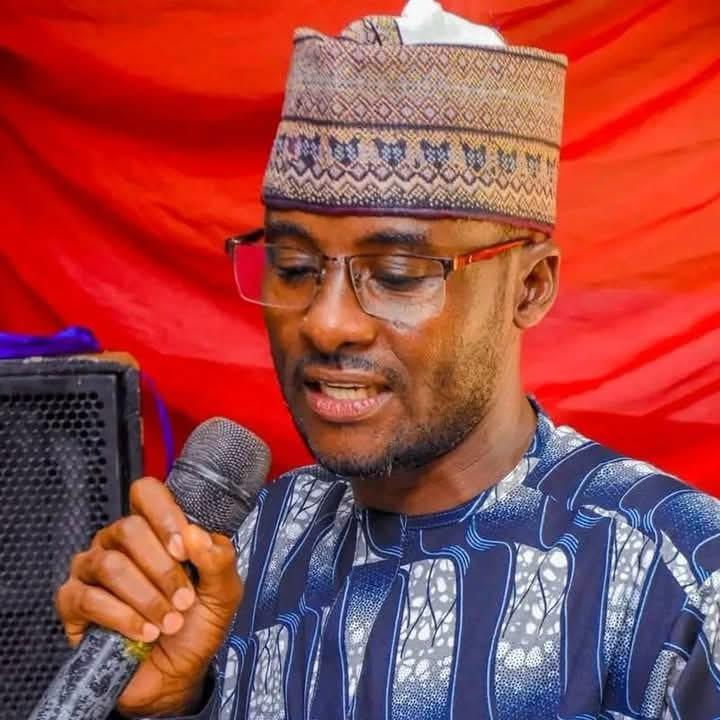 Comrade Bishir Ibrahim Gyaza speaking into a microphone